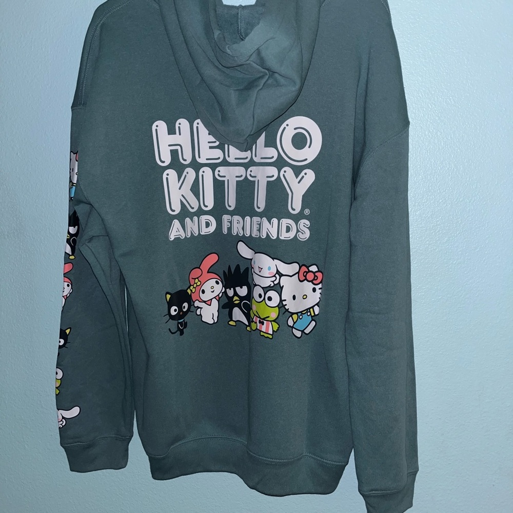 The size is XL and it is a light green zip up.